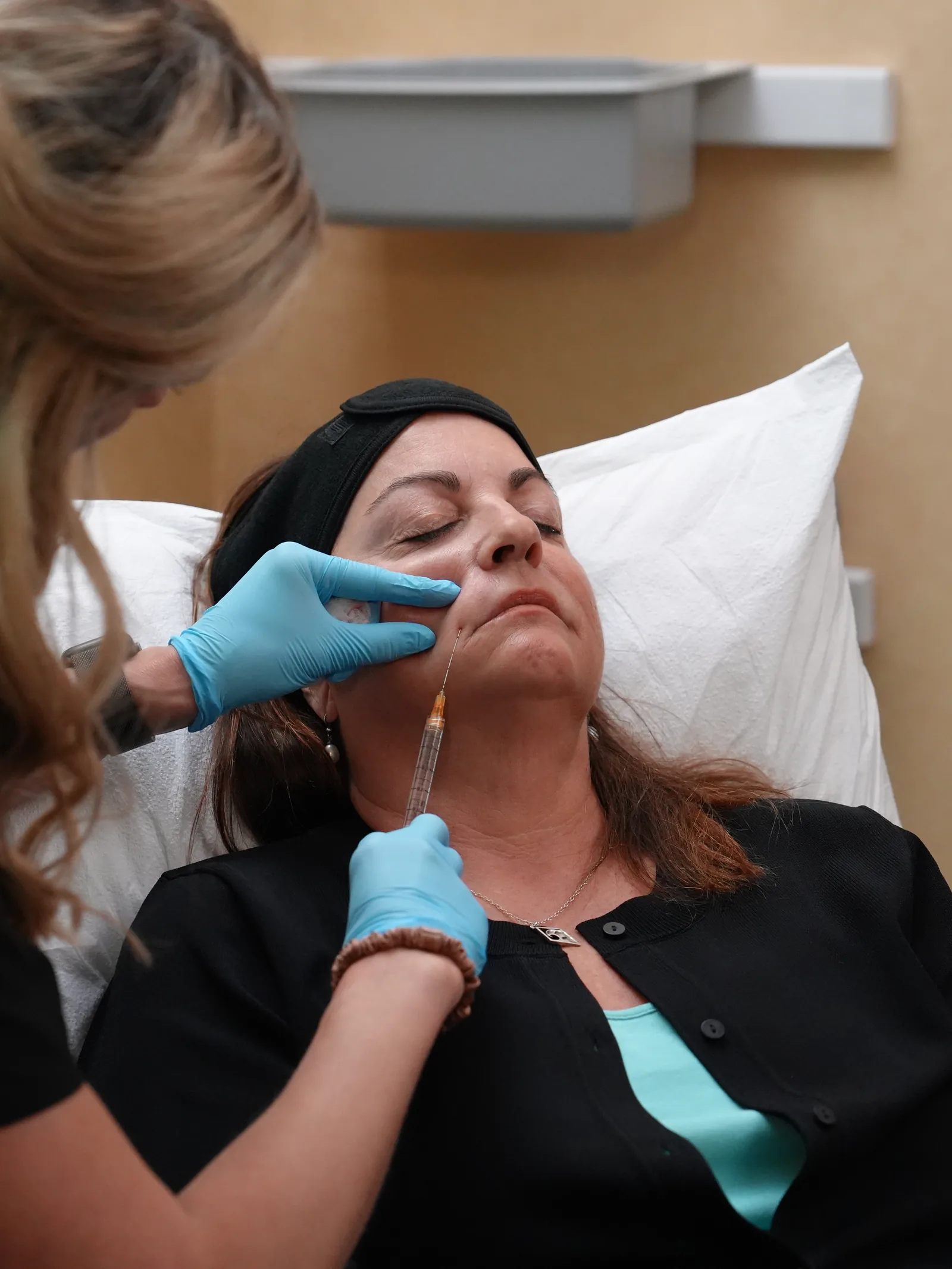Megan Sosnick placing filler along the lip line at Reviv Med Spa, Millbrae