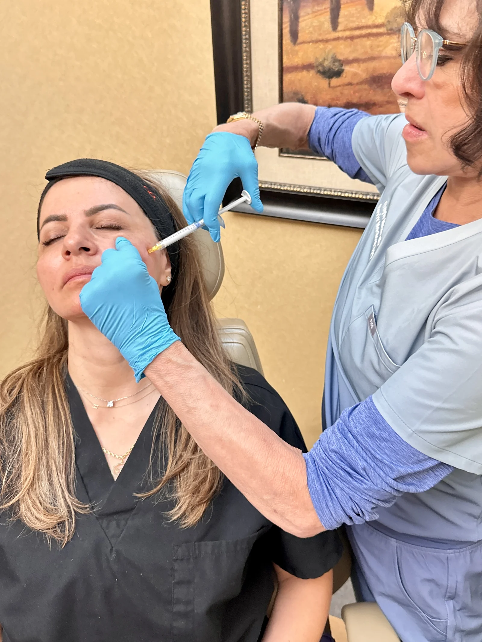 A Reviv Med Spa provider performing a facial injectable treatment in Millbrae