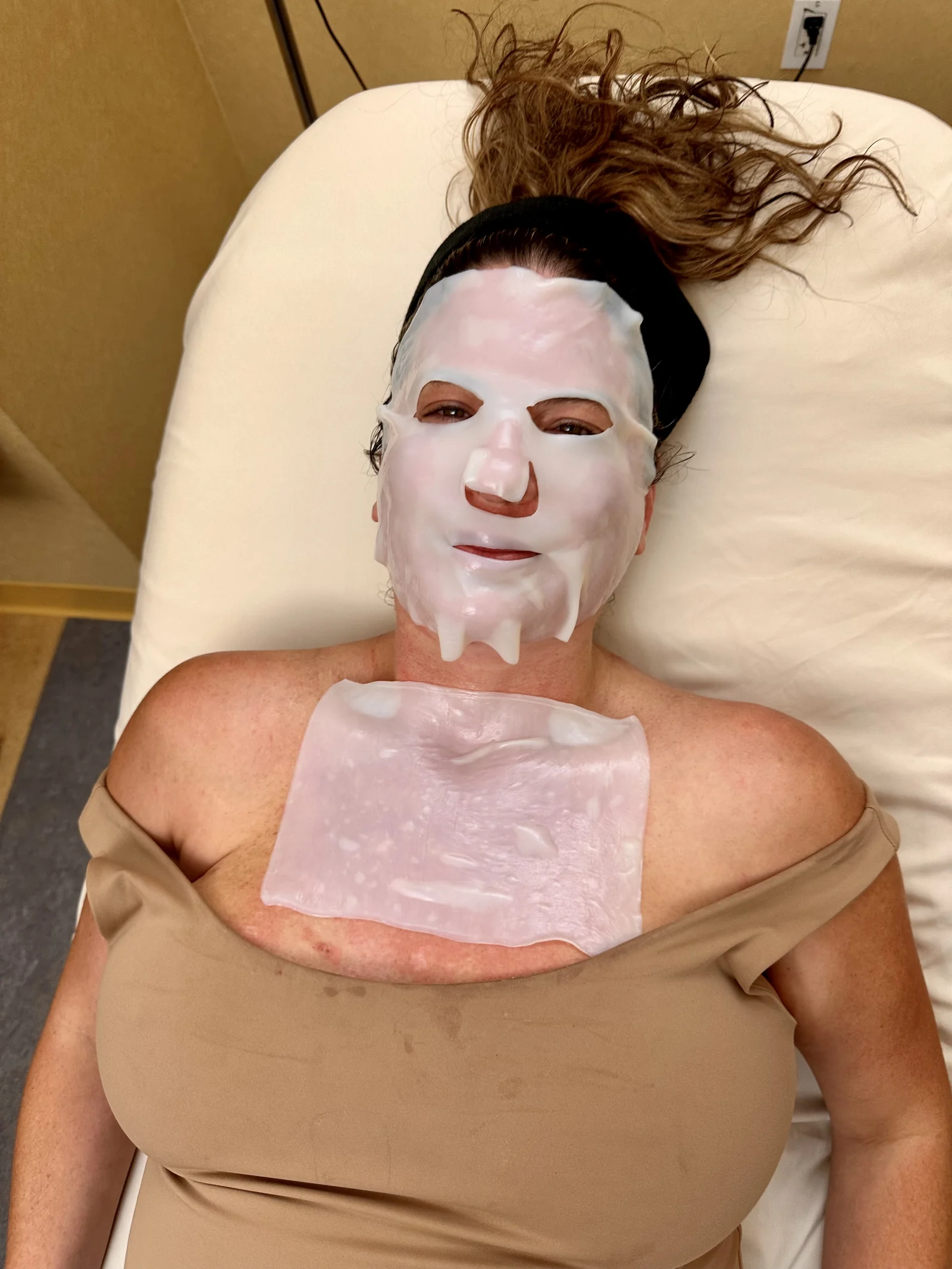 Patient receiving a Renewal Ritual treatment with hydrating sheet mask
